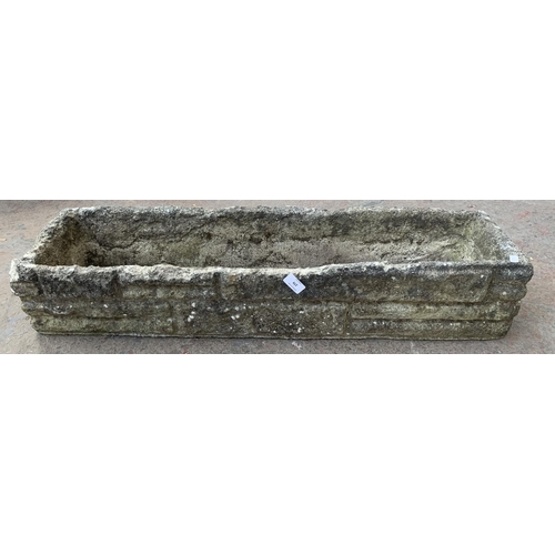 279 - A cast stone garden planter - approx. 18cm high x 90cm wide x 23cm deep