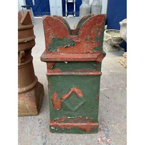 280 - A red painted cast stone chimney pot - approx. 70cm high x 28cm wide x 30cm deep