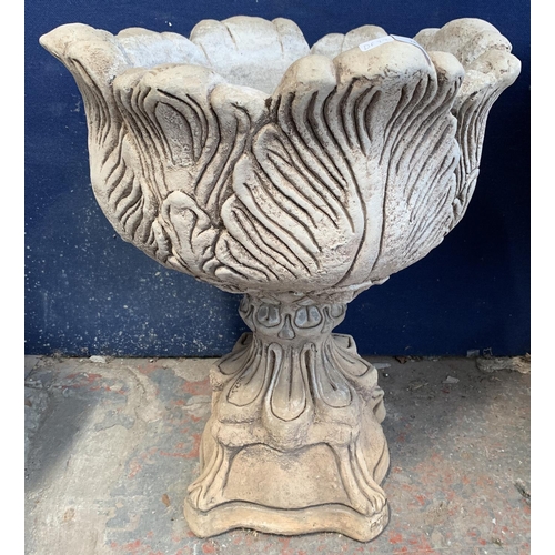 283 - An AJH cast stone tulip urn on plinth garden planter - approx. 62cm high 48cm diameter