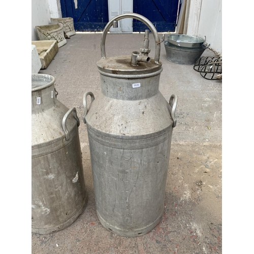 287 - Two galvanised milk churns - largest approx. 90cm high