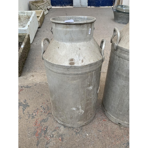 287 - Two galvanised milk churns - largest approx. 90cm high