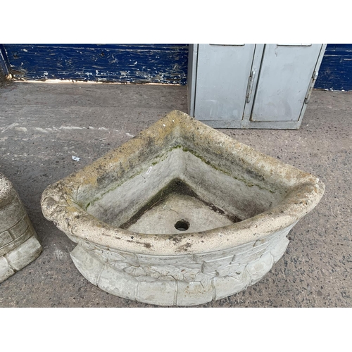 289 - A pair of cast stone corner garden planters - approx. 29cm high x 62cm wide x 43cm deep