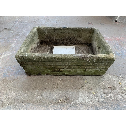 292 - A cast stone rectangular garden planter - approx. 22cm high x 52cm wide x 64cm long