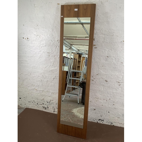 297 - A modern Dwell walnut effect wall mirror - approx. 182cm high x 45cm wide