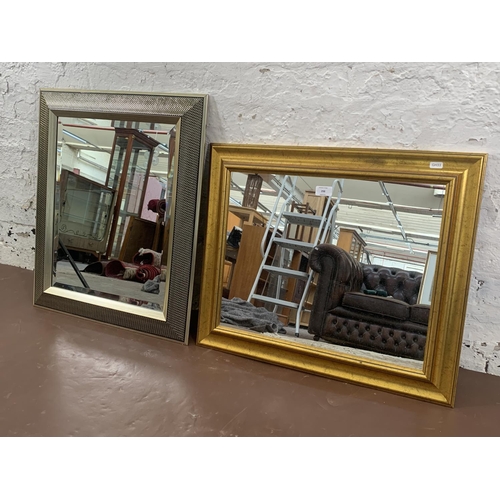 298 - Two modern wall mirrors - largest approx. 67cm high x 54cm wide