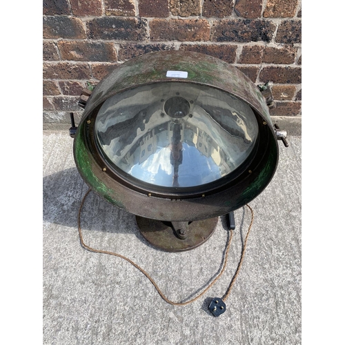 29B - A WWII era green painted steel adjustable and swivel military searchlight - approx. 71cm high x 49cm... 