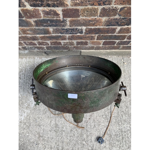 29B - A WWII era green painted steel adjustable and swivel military searchlight - approx. 71cm high x 49cm... 