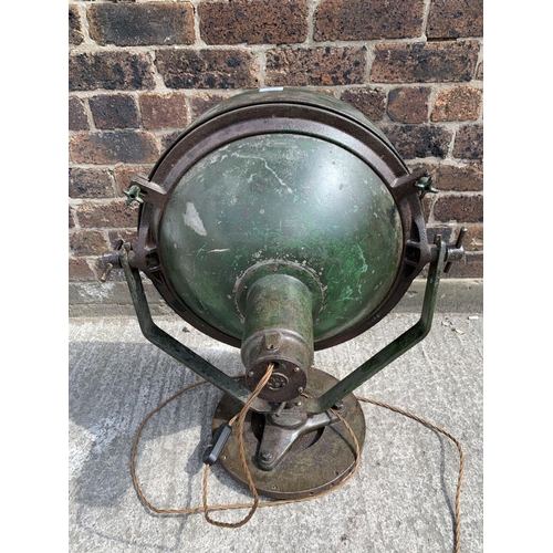 29B - A WWII era green painted steel adjustable and swivel military searchlight - approx. 71cm high x 49cm... 