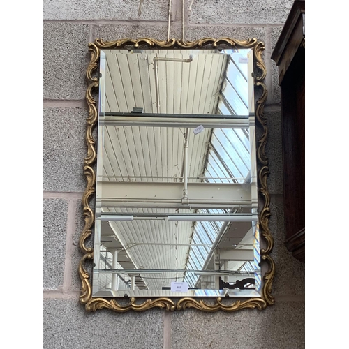 302 - A Rococo style gilt framed bevelled edge wall mirror - approx. 67cm high x 45cm wide