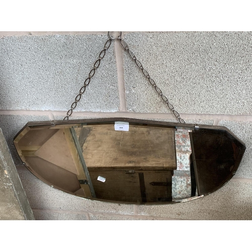 304 - A mid 20th century bevelled edge wall mirror - approx. 38cm high x 64cm wide