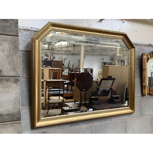 305 - A modern gilt framed bevelled edge overmantle wall mirror - approx. 88cm high x 110cm wide