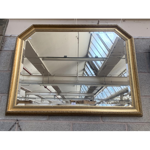 305 - A modern gilt framed bevelled edge overmantle wall mirror - approx. 88cm high x 110cm wide