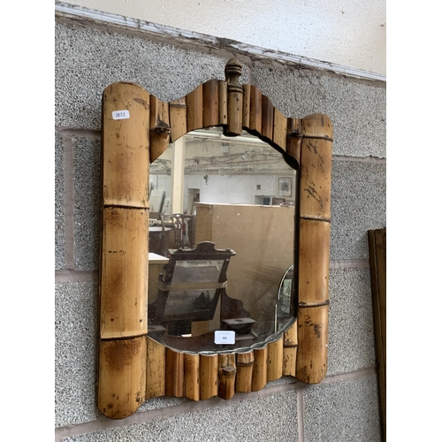 306 - A mid 20th century bamboo framed wall mirror - approx. 59cm high x 45cm wide