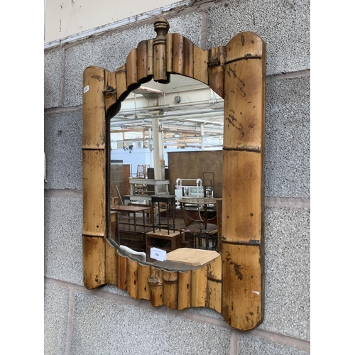 306 - A mid 20th century bamboo framed wall mirror - approx. 59cm high x 45cm wide