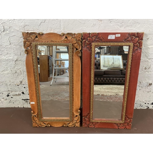 310 - Two modern oriental style decorative wall mirrors - approx. 64cm high x 34cm wide