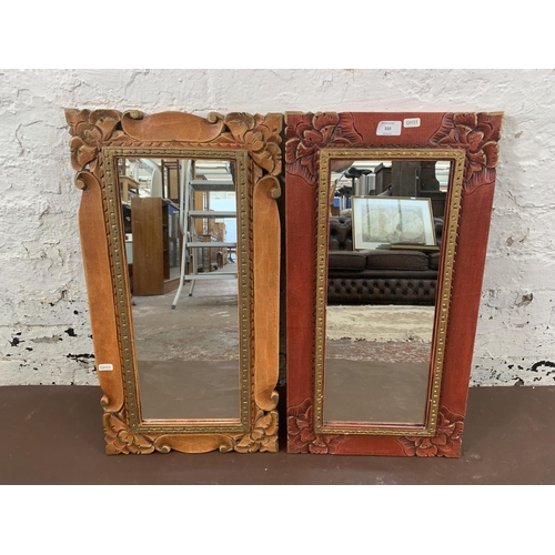 310 - Two modern oriental style decorative wall mirrors - approx. 64cm high x 34cm wide