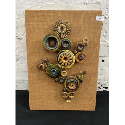 324 - A mid 20th century ceramic abstract wall sculpture - approx. 53cm high x 36cm wide