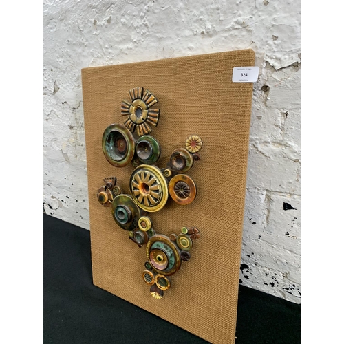 324 - A mid 20th century ceramic abstract wall sculpture - approx. 53cm high x 36cm wide