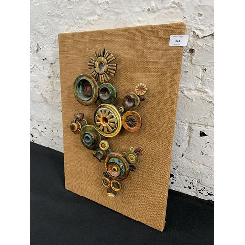 324 - A mid 20th century ceramic abstract wall sculpture - approx. 53cm high x 36cm wide