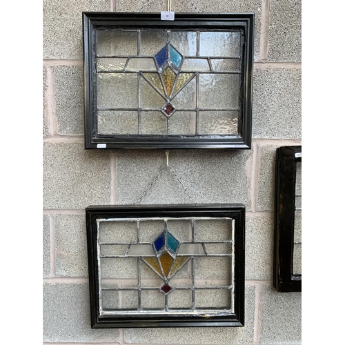 33 - Three 1930s wooden framed lead and stained glass windows - two approx. 39cm high x 49cm wide and one... 