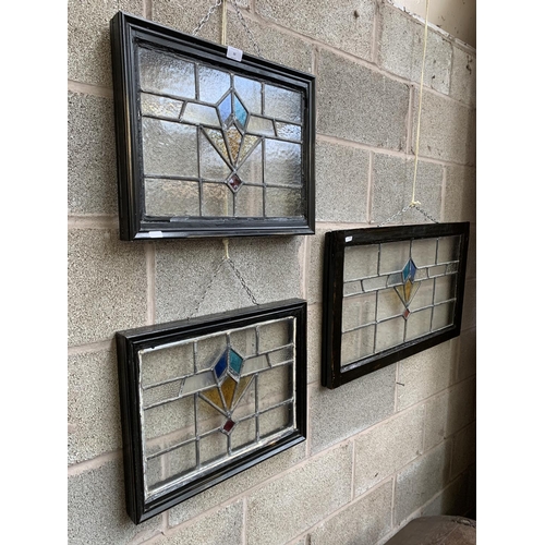 33 - Three 1930s wooden framed lead and stained glass windows - two approx. 39cm high x 49cm wide and one... 