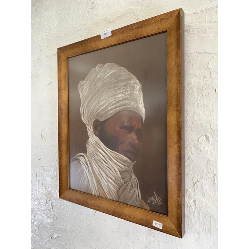 331 - A framed fabric portrait painting of an African gentleman, signed lower right - approx. 52cm high x ... 