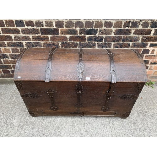 34 - An 18th century German oak and metal banded dome top chest with lower drawer - approx. 79cm high x 1... 