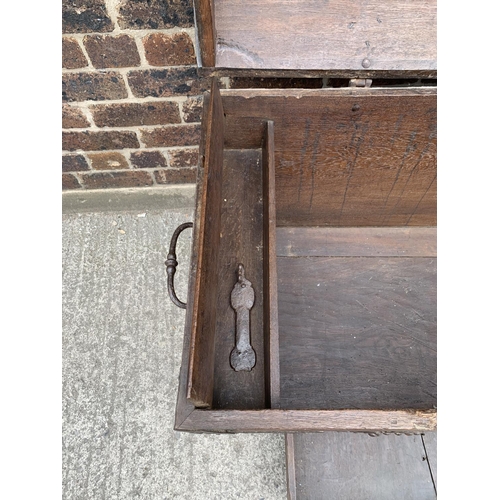 34 - An 18th century German oak and metal banded dome top chest with lower drawer - approx. 79cm high x 1... 