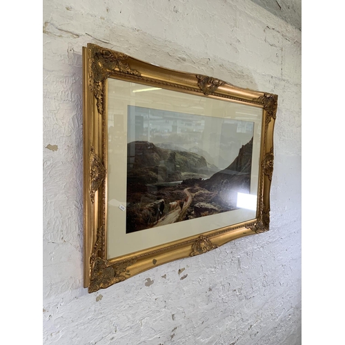 354 - A gilt framed landscape print - approx. 68cm high x 105cm wide