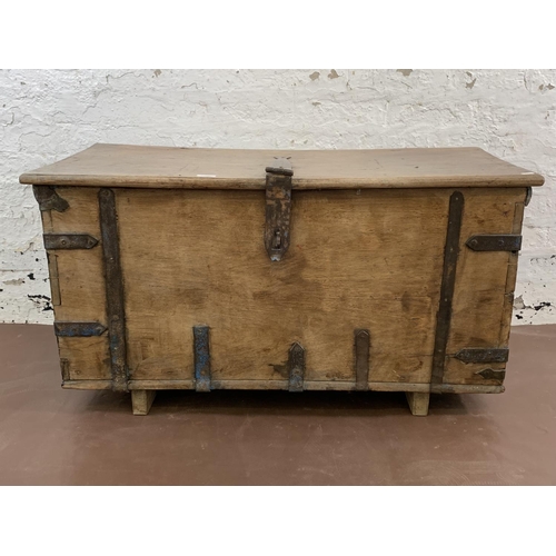 36 - A 19th century teak and iron banded chest - approx. 57cm high x 104cm wide x 47cm deep