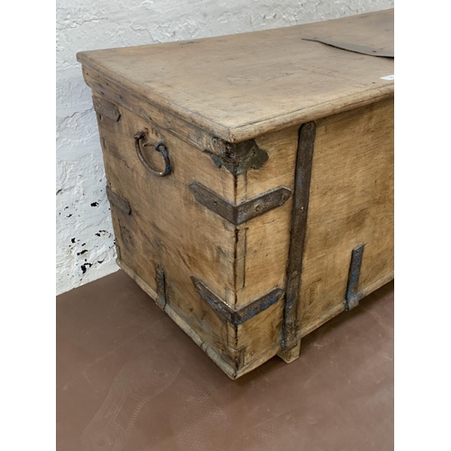 36 - A 19th century teak and iron banded chest - approx. 57cm high x 104cm wide x 47cm deep
