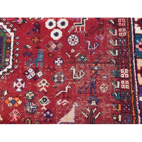 4 - A 20th century machine woven Shiraz rug - approx. 298cm x 210cm