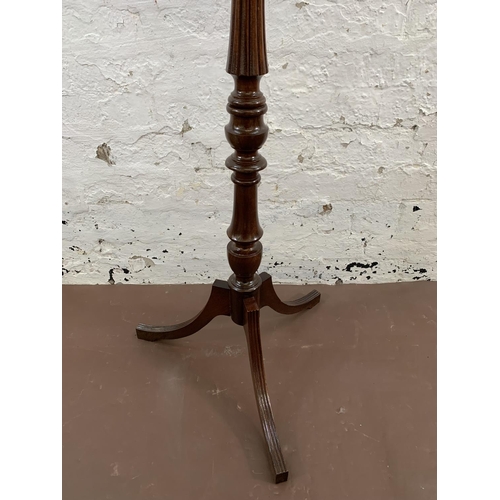 41 - A 19th century style mahogany circular top tripod jardinière stand - approx. 100cm high x 27cm diame... 