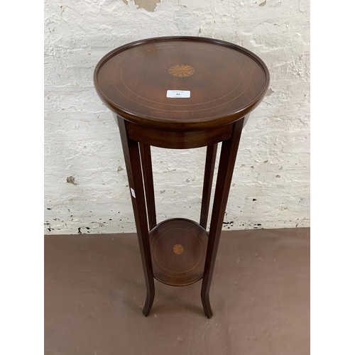 43 - An Edwardian inlaid mahogany circular two tier jardinière stand - approx. 96cm high x 32cm diameter