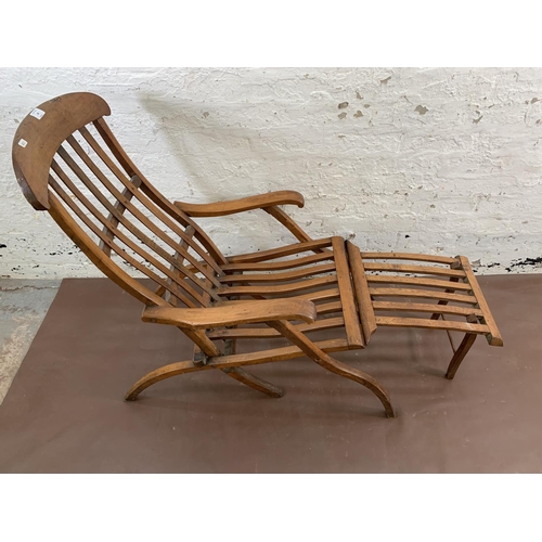 48 - An early 20th century beech folding steamer chair