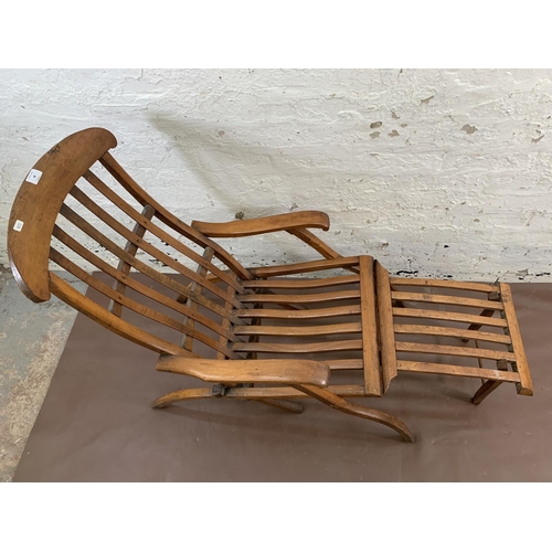 48 - An early 20th century beech folding steamer chair