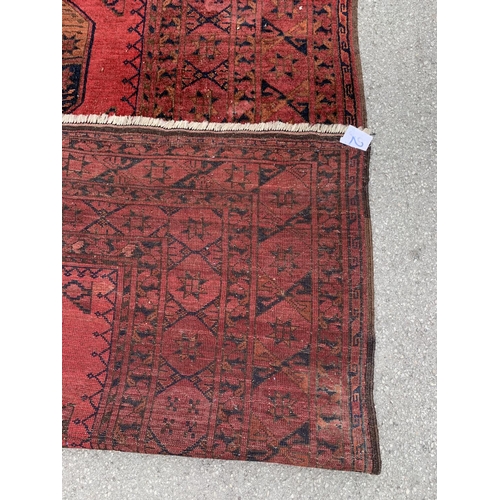 5 - A 20th century Afghan red ground rug - approx. 375cm x 285cm