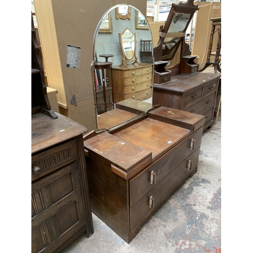 51 - An Art Deco style oak and walnut dressing table with upper bevelled edge mirror - approx. 153cm high... 