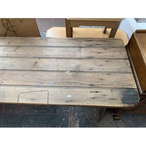 53 - An early 20th century pine trestle table - approx. 76cm high x 242cm wide x 60cm deep