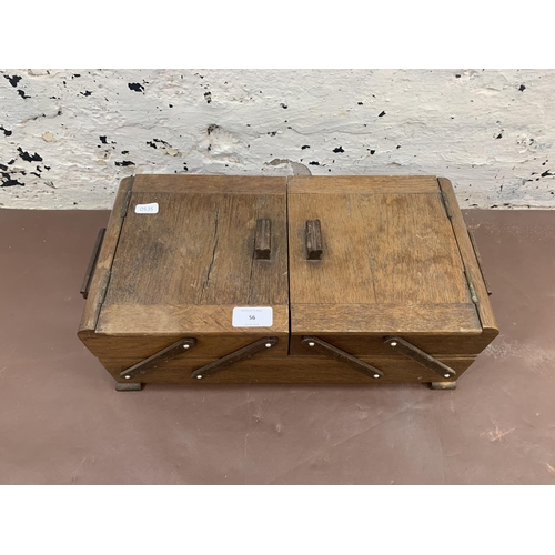 56 - A mid 20th century oak concertina sewing box - approx. 17cm high x 41cm wide x 22cm deep
