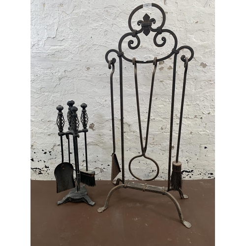 57 - Two wrought and cast iron companion sets - largest approx. 103cm high