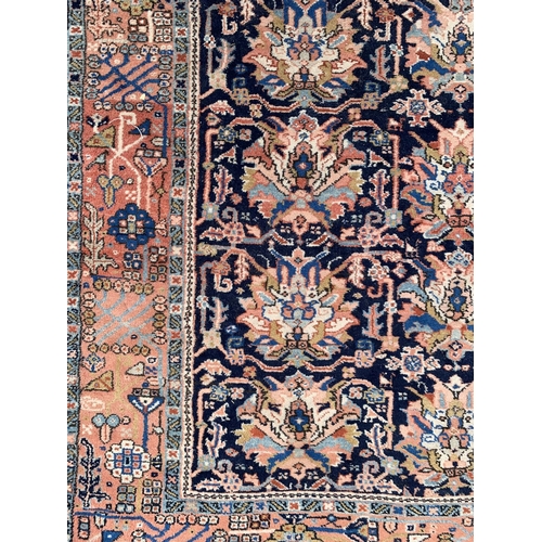 6 - A 20th century machine woven blue ground rug - approx. 230cm x 160cm