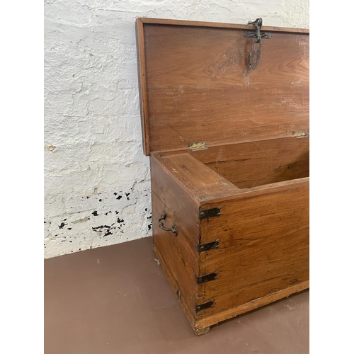 60 - A 19th century camphor wood and metal banded blanket box - approx. 45cmhigh x 90cm wide x 42cm deep
