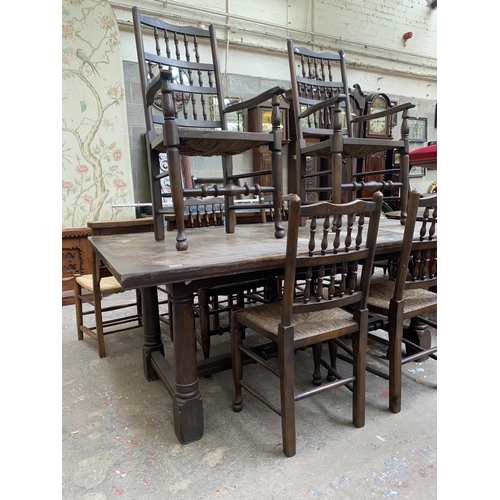68 - A 17th century style solid oak refectory table and six Lancashire style elm and rush seated dining c... 
