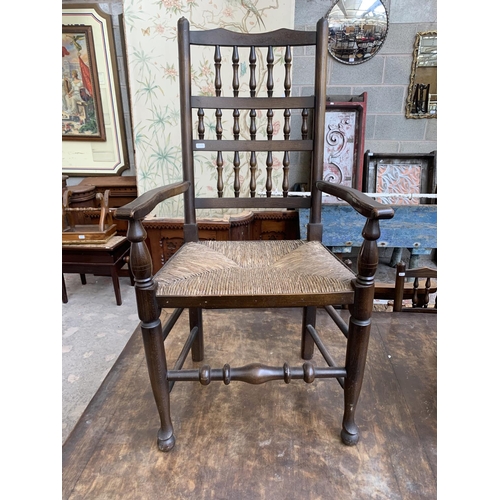 68 - A 17th century style solid oak refectory table and six Lancashire style elm and rush seated dining c... 