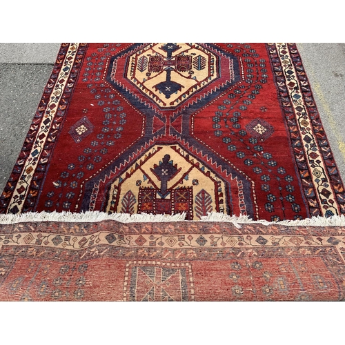 7 - A 20th century Kashqai rug - approx. 260cm x 168cm