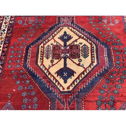 7 - A 20th century Kashqai rug - approx. 260cm x 168cm