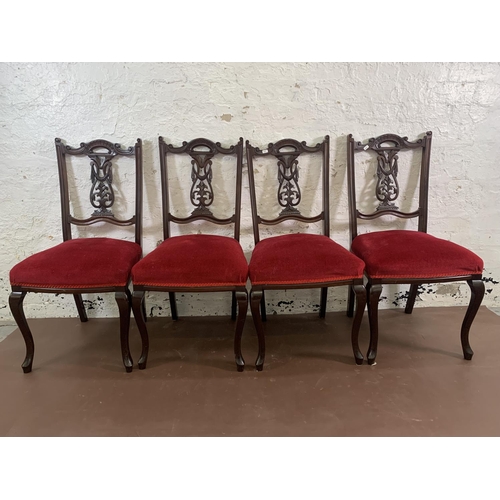 70 - Four Edwardian carved mahogany and red fabric upholstered dining chairs