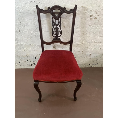 70 - Four Edwardian carved mahogany and red fabric upholstered dining chairs