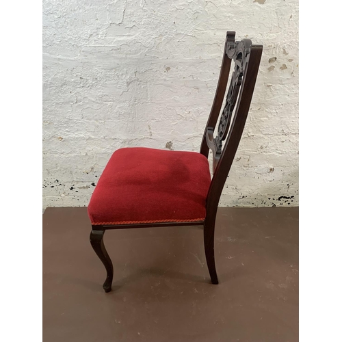 70 - Four Edwardian carved mahogany and red fabric upholstered dining chairs
